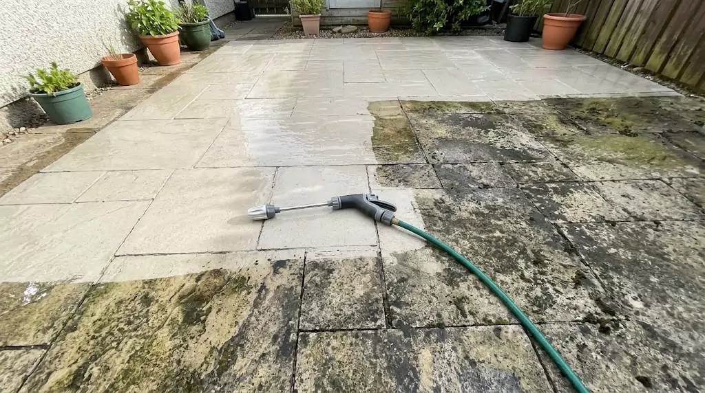 Jetterix LongoMetap test on a 32-m² stone patio — clear line between cleaned and uncleaned section